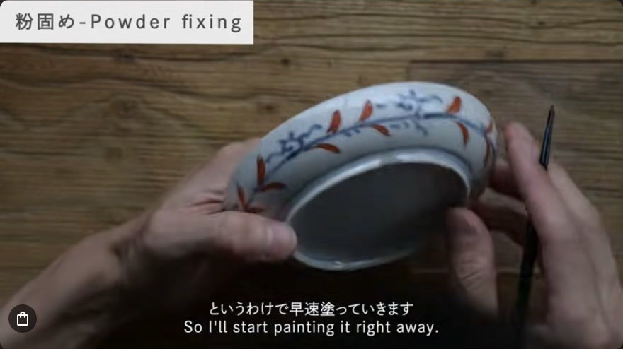 Apply fixing lacquer over the powder — A fine brush applies raw fixing lacquer directly over the metal-powder line.