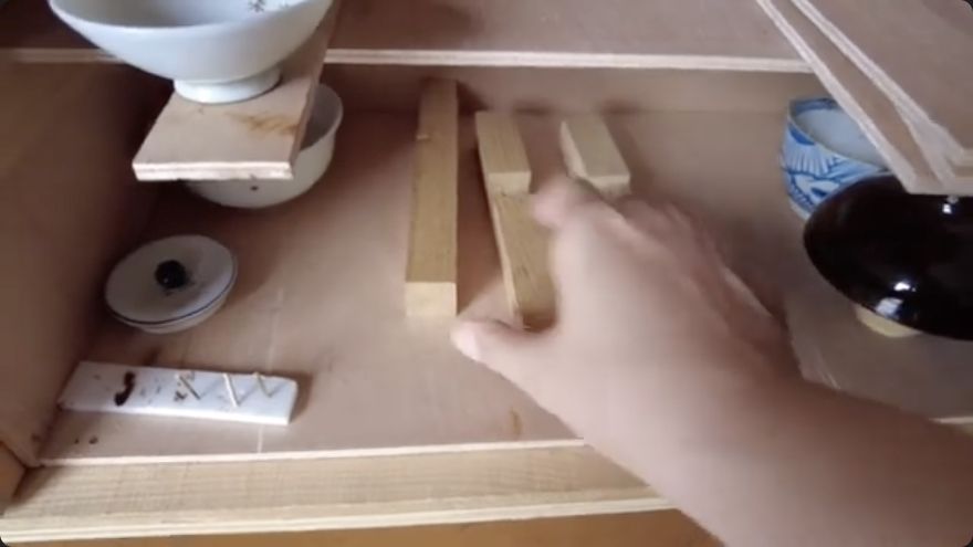 Place and prop the pieces — The source demonstrates: Place and prop the pieces.